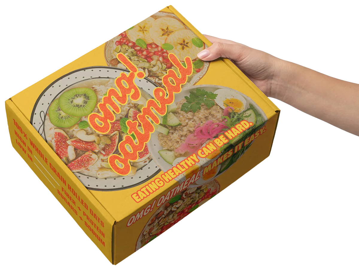 OMG! Oatmeal custom printed mailer box held in a hand